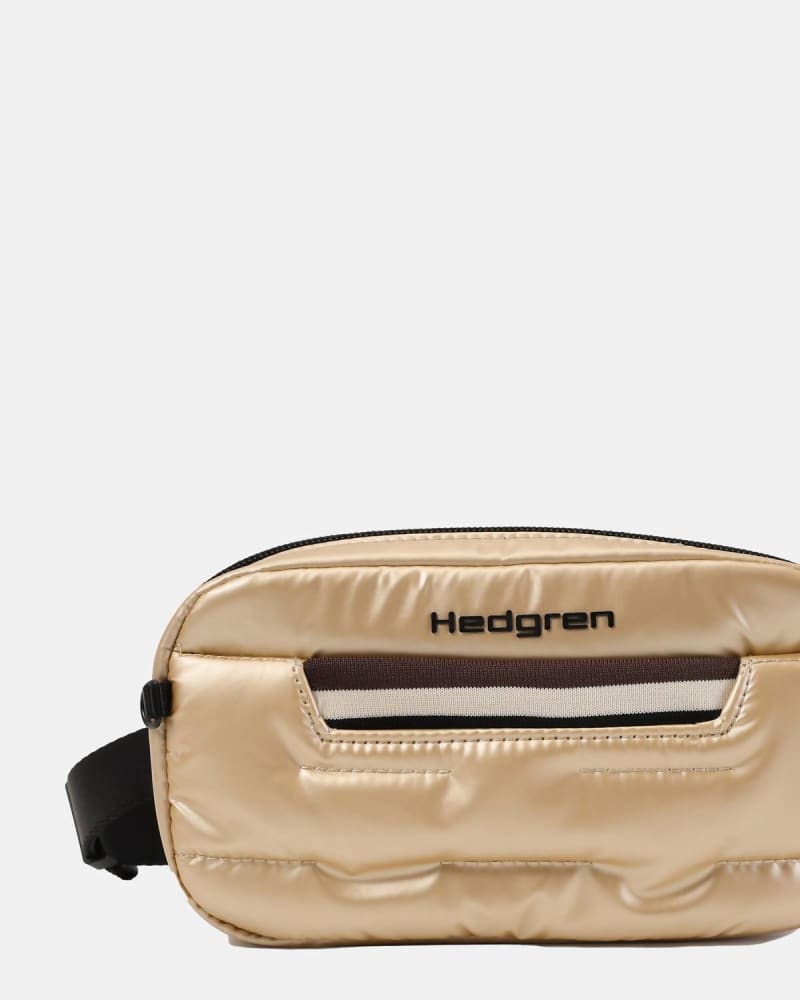 Front of a model wearing a size O/S Snug Crossbody/Waist Pack Bag In Safari Beige in Safari Beige by Hedgren. | dia_product_style_image_id:355124